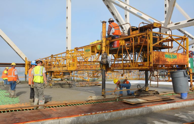 Crews with Walsh Construction pouring the concrete for the new deck on the Kennedy Bridge.