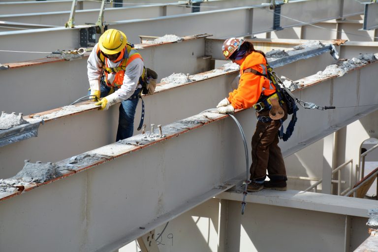 Two men working on the Abraham Lincoln Bridge